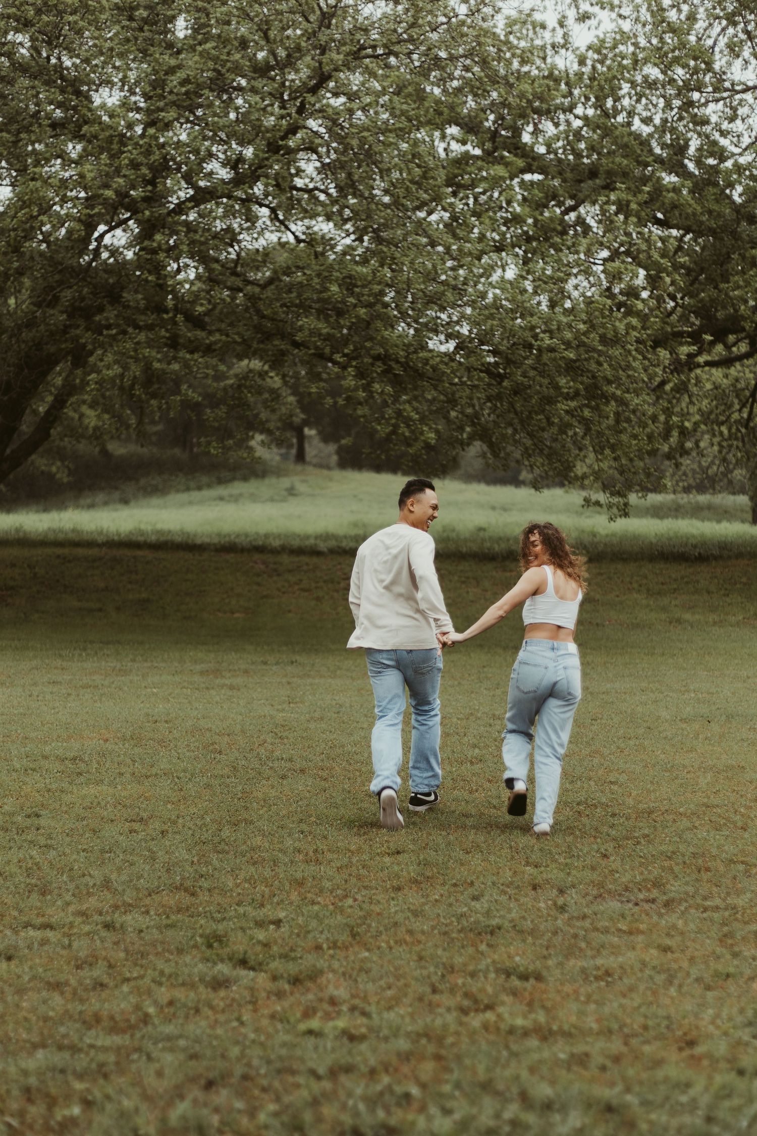 Couple running in greenery