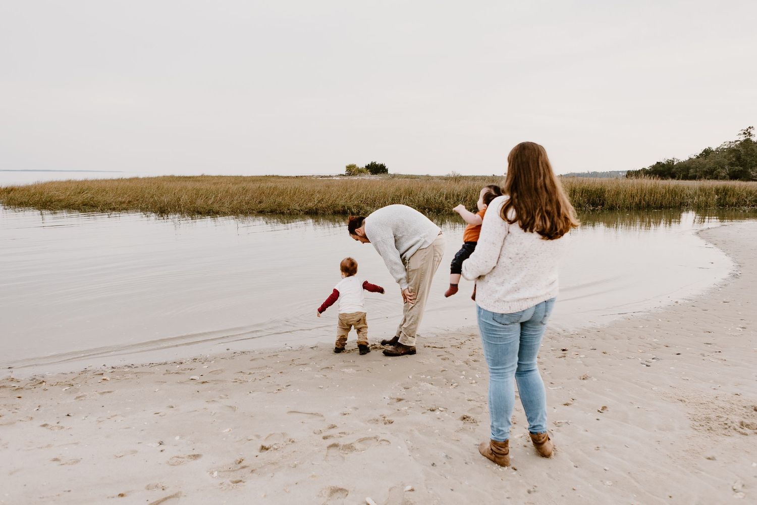 family by the water