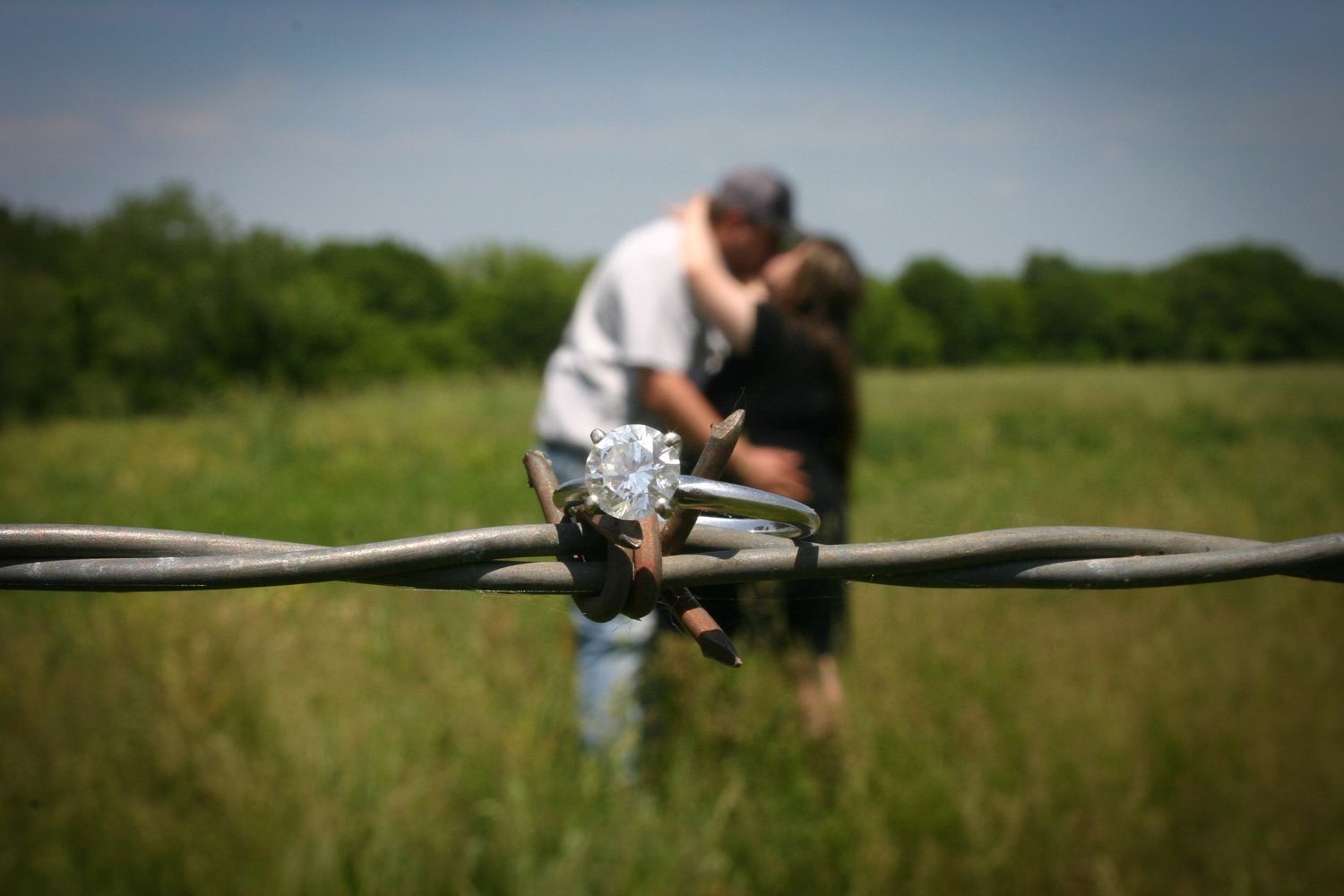 engagement ring photo, engagement ring on barbed wire engagement pictures, cowboy and cowgirl engagement, engagement idea