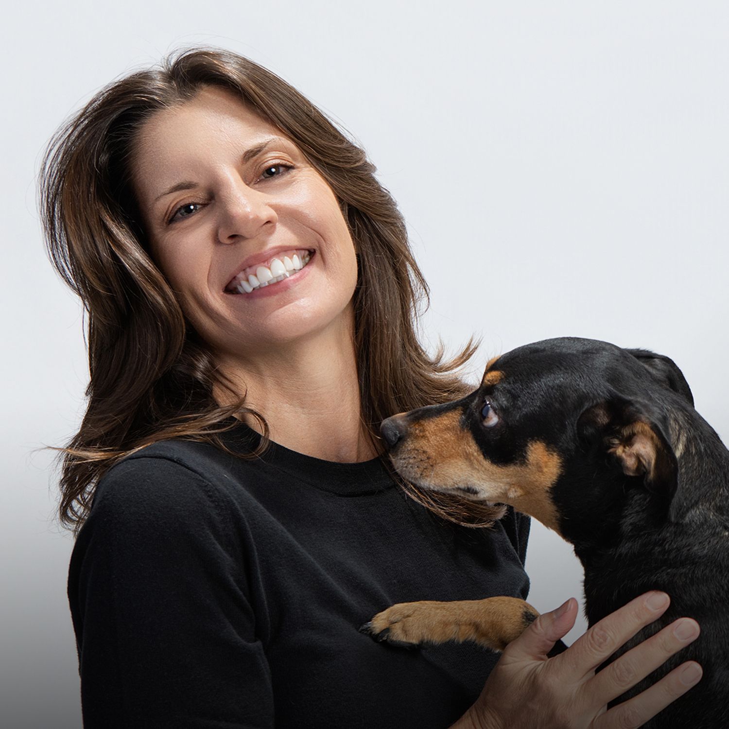 Jane Fidanza, photographer and owner of Fetching Fido Fotography in Austin, Texas, is pictured with her dog, Giovanni.
