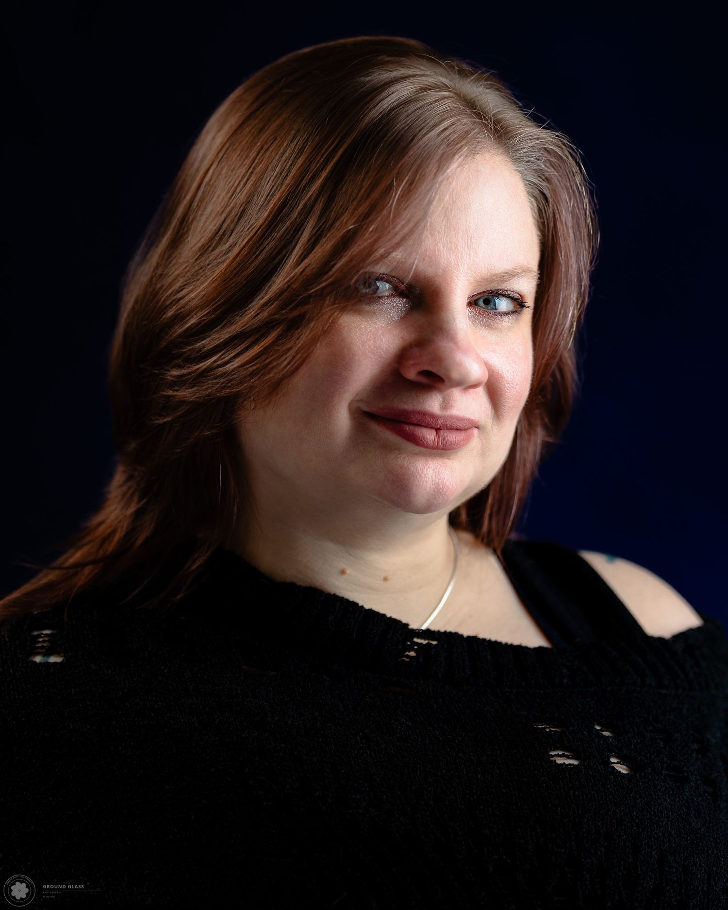 Portrait of a local business owner with chiaroscuro lighting — headshot photography by Ground Glass Photography, Kent WA