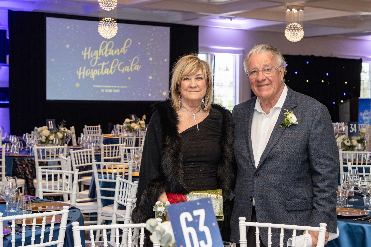 Elegant couple posing together at the Highland Hospital Gala fundraising dinner event.
