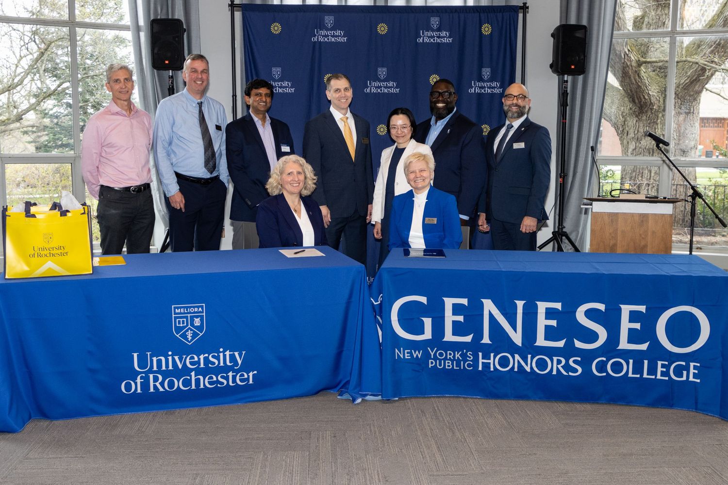 University of Rochester and SUNY Geneseo Honors College officials sign partnership agreement.