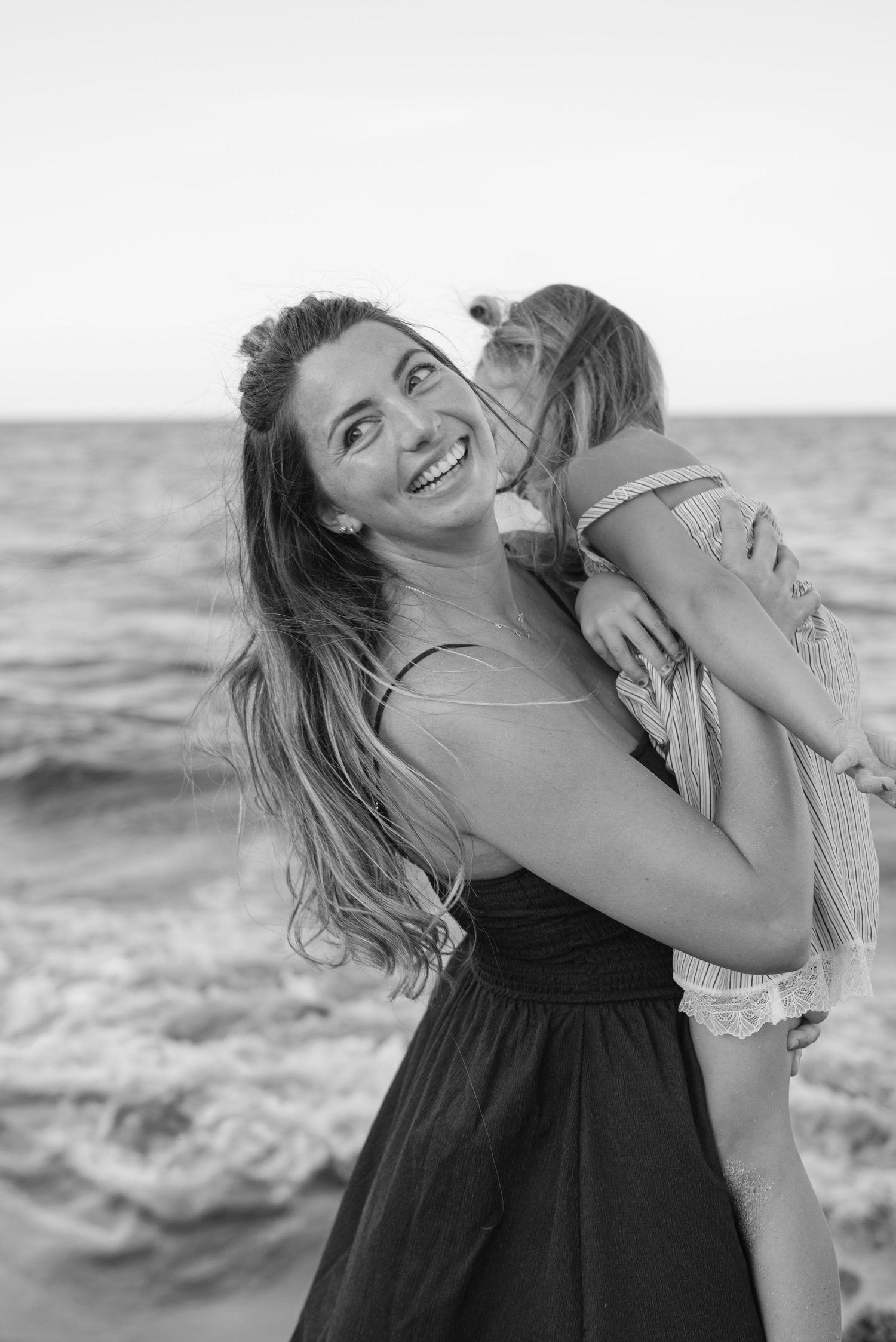 Timeless motherhood photography, location Sunrise Beach, Palm Beach Florida.