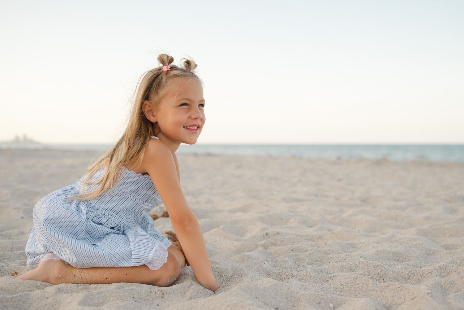 Adorable candid image of child at Palm Beach Municipal beach taken by Lynae Moir Photography.