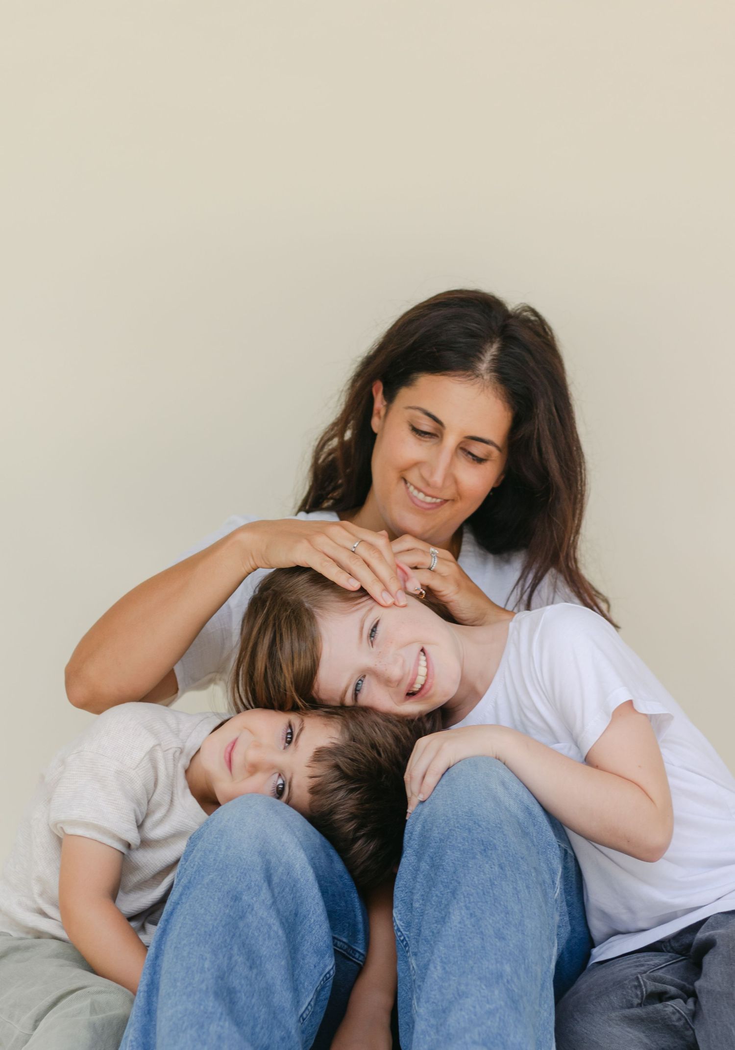 Mother with two young children in a studio photoshoot in Boca Raton FL.