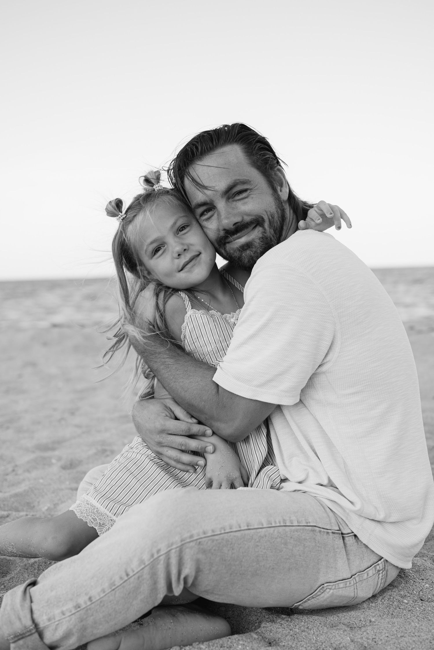 Father and daughter sweetly posed at Sunrise Beach, Palm Beach FL.
