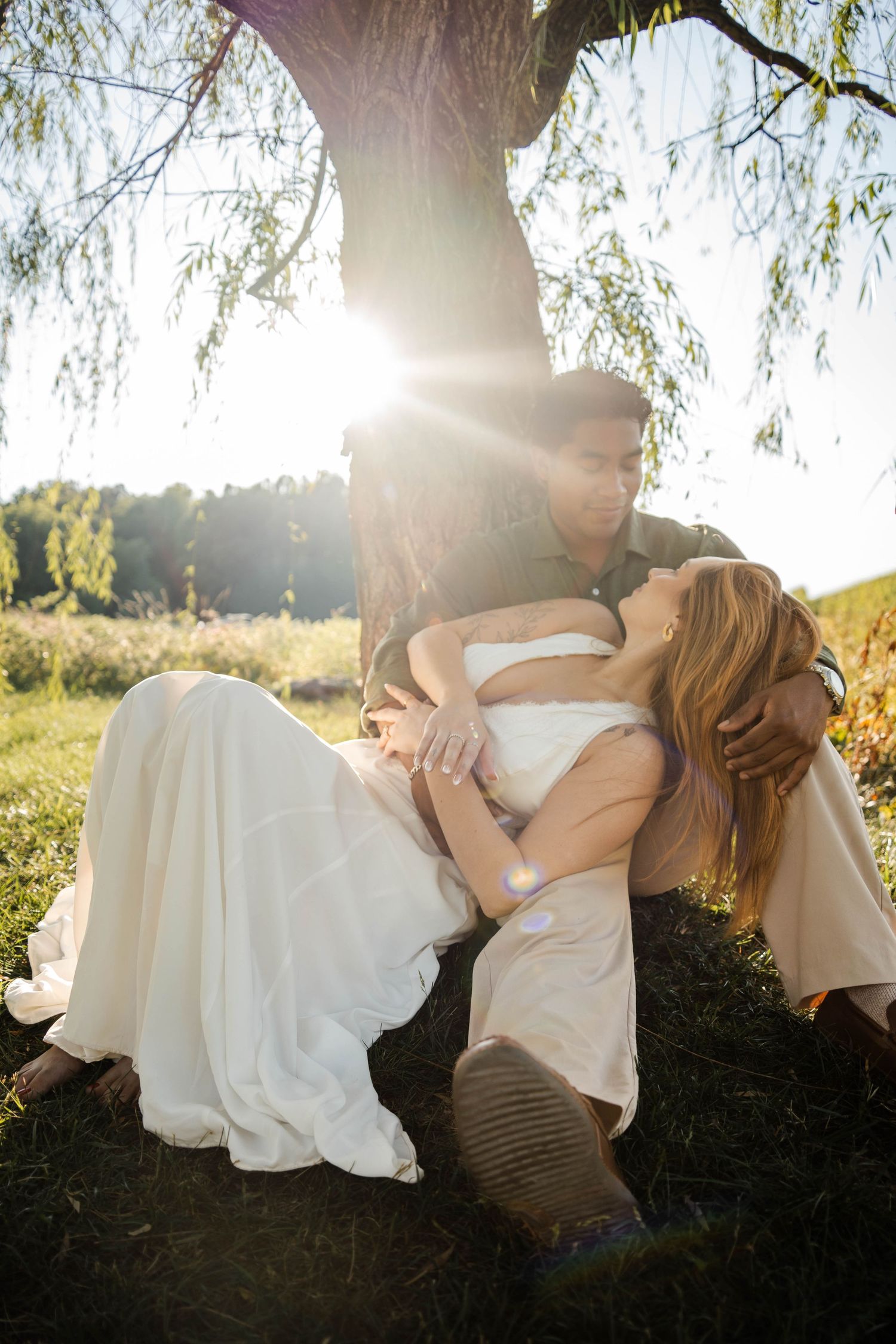 Raleigh North Carolina engagement session at the North Carolina Museum of Art with a romantic outdoor couple portrait.