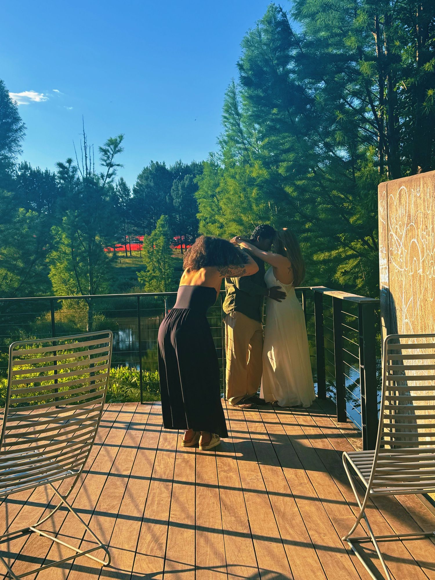 Behind the scenes of Dyamond photographing an engagement session at the North Carolina Museum of Art in Raleigh.