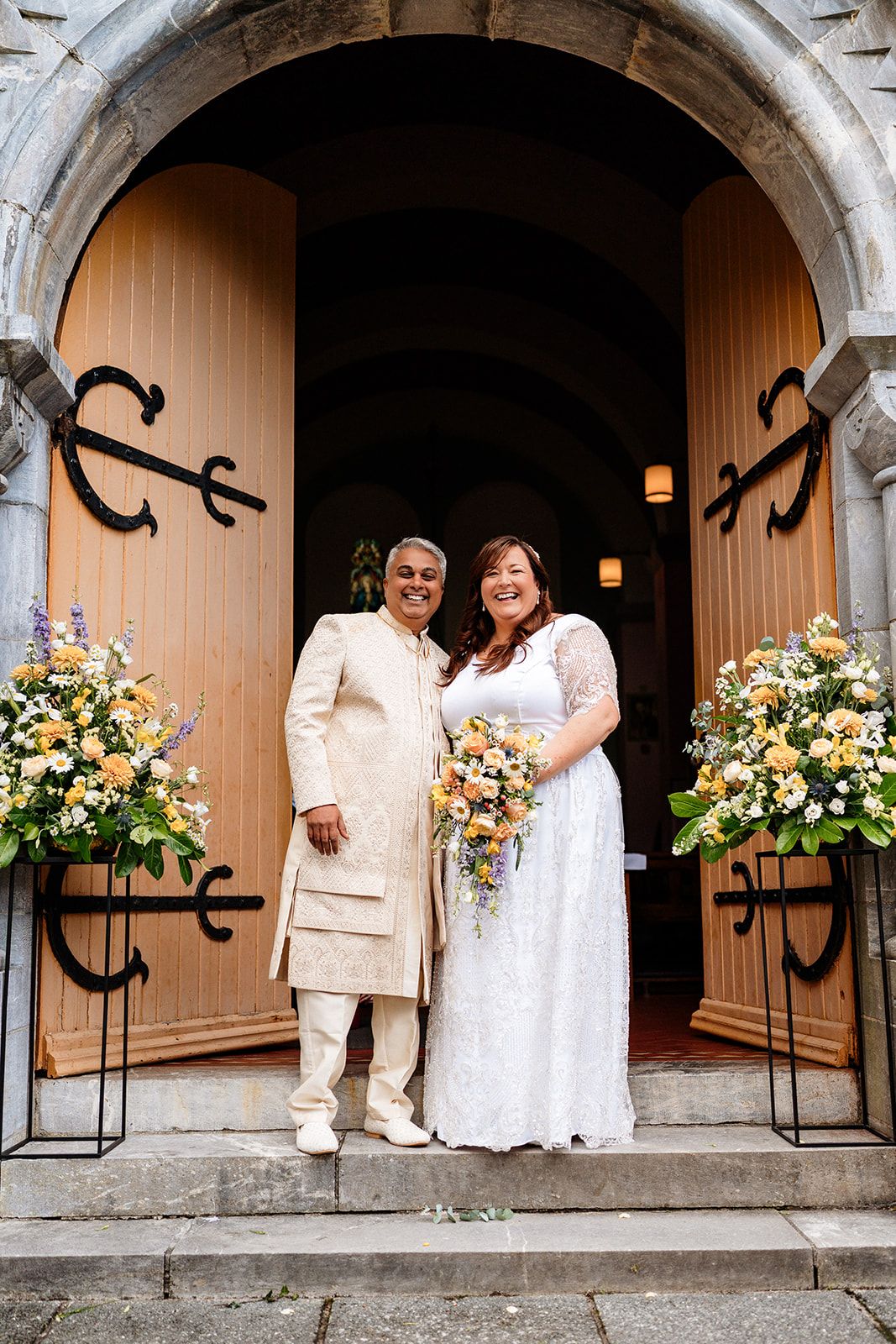 A series of elegant archway photographs showing a couple in white attire with floral arrangements decorating the stone entrance.