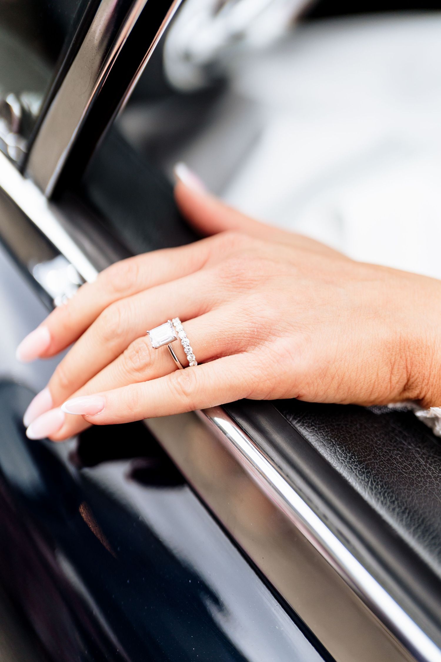 Close-up photo of a hand pressing keys on a piano keyboard with soft selective focus.