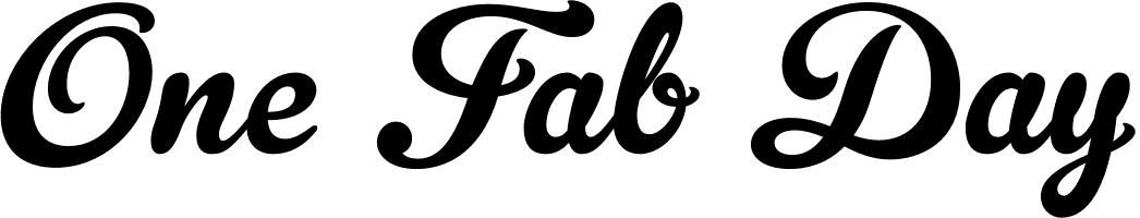A black and white vintage-style logo design with decorative text reading 'One Pub Day' in cursive lettering.