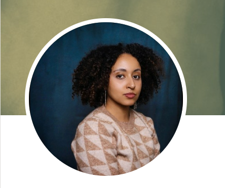 Artistic circular portrait with person wearing geometric patterned sweater against blue backdrop.