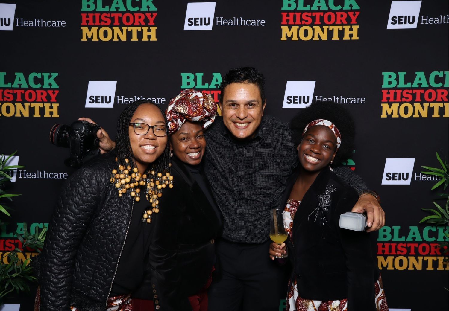 Group photo of healthcare workers celebrating Black History Month with SEIU Healthcare banners.