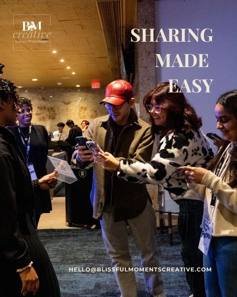 A group of people gathered in an indoor venue reading from papers in a dimly lit space.