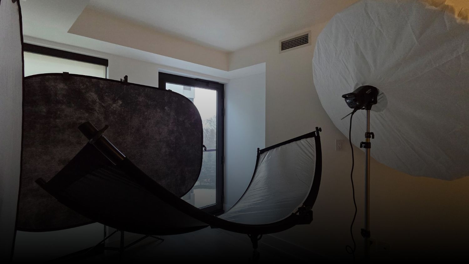 Photography studio interior with professional lighting equipment and modifiers.