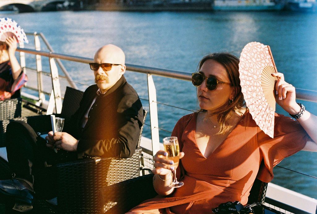 Candid cocktail hour portrait 35mm film photography, reflecting the authentic and timeless style of Veronique Jones.