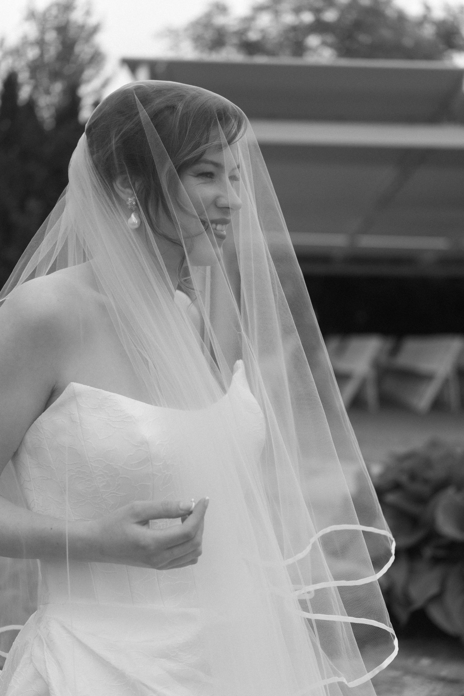 Artful B&W wedding portrait by Veronique Jones. A refined, timeless narrative capturing raw emotion and sophisticated editorial style.