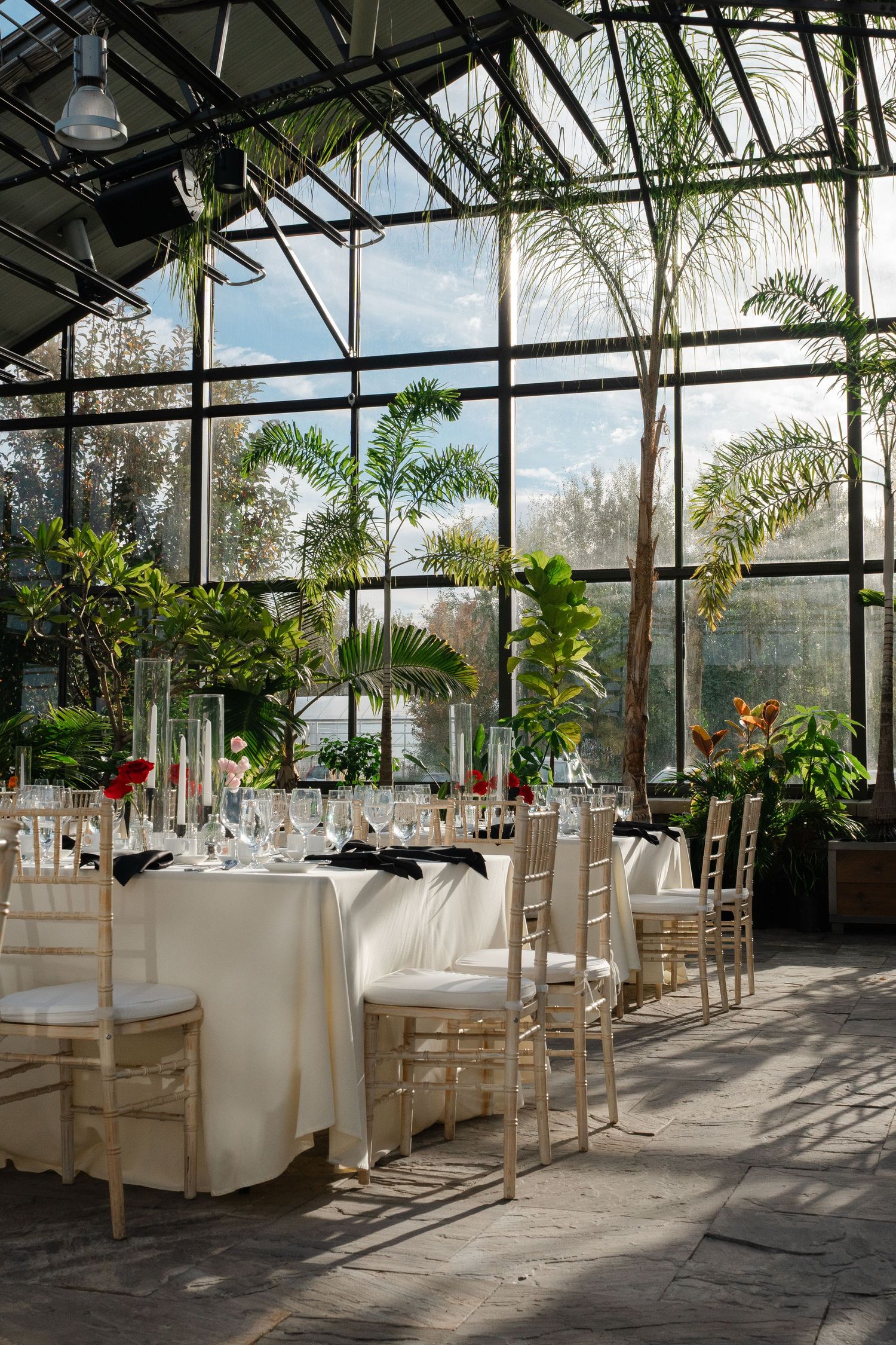 Luxe wedding tablescape at Aquatopia by Veronique Jones. Capturing high-end floral design and editorial conservatory aesthetics.