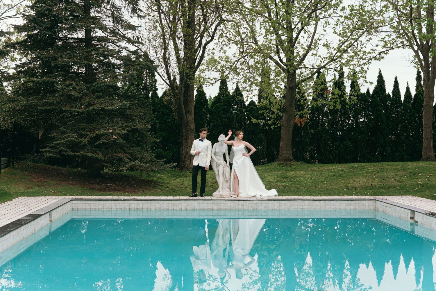 editorial photo of bride and groom by pool by montreal and destination wedding photographer Veronique Jones