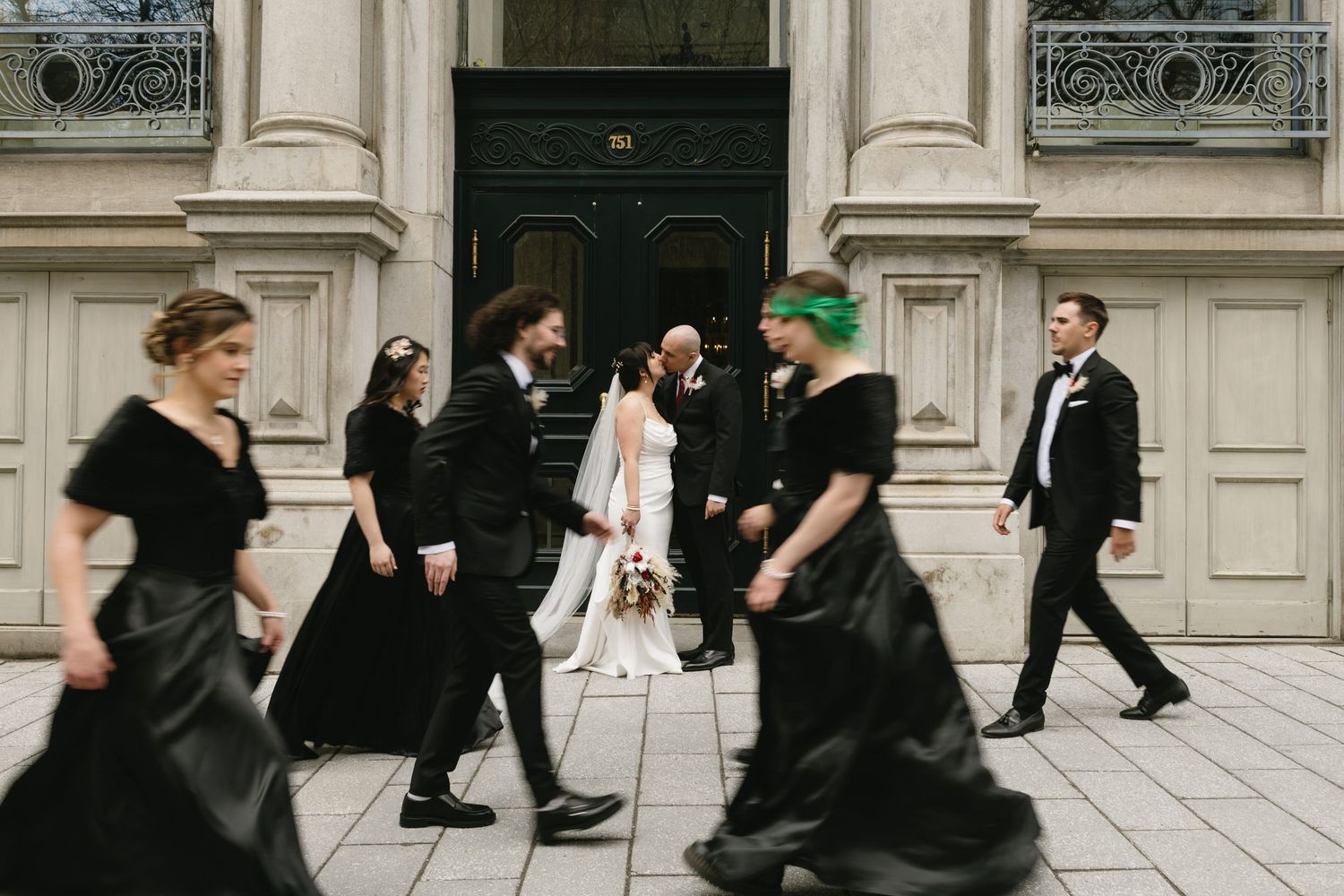 motion blur photo of newlyweds with their bridal party by Veronique Jones, Montreal wedding photographer