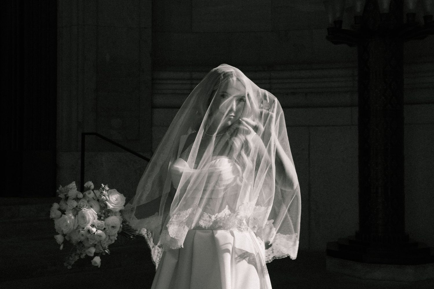 A modern romantic bride in contrasted, moody light in Montreal, captured by Veronique Jones with a refined, editorial eye.