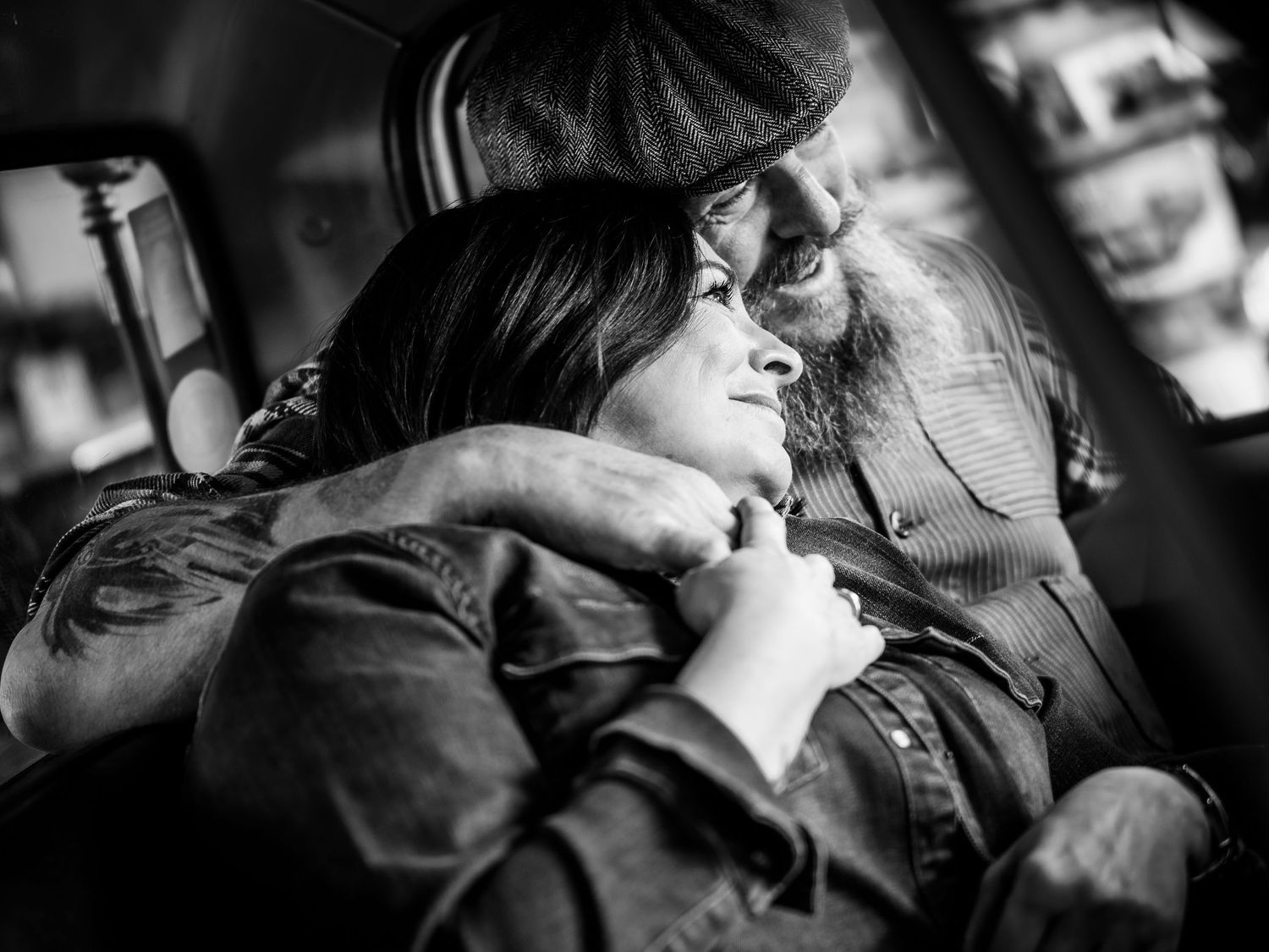Black and white photo series showing tender moments between two people sharing intimate kisses in various settings.