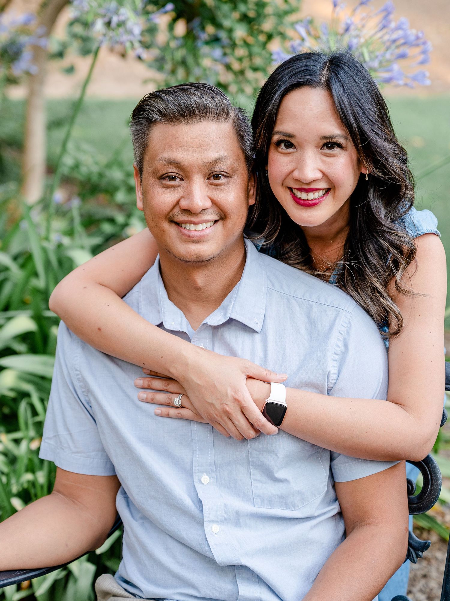 A happy couple posing for a photo at Jensen Botanical Garden in Fair Oaks, California