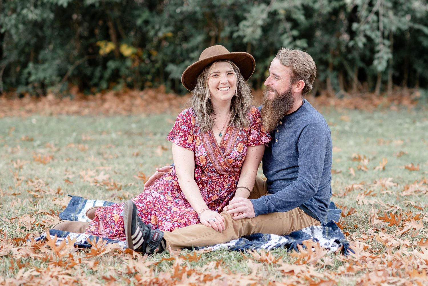 A couple sitting together on a blanket at Orangevale Community Park