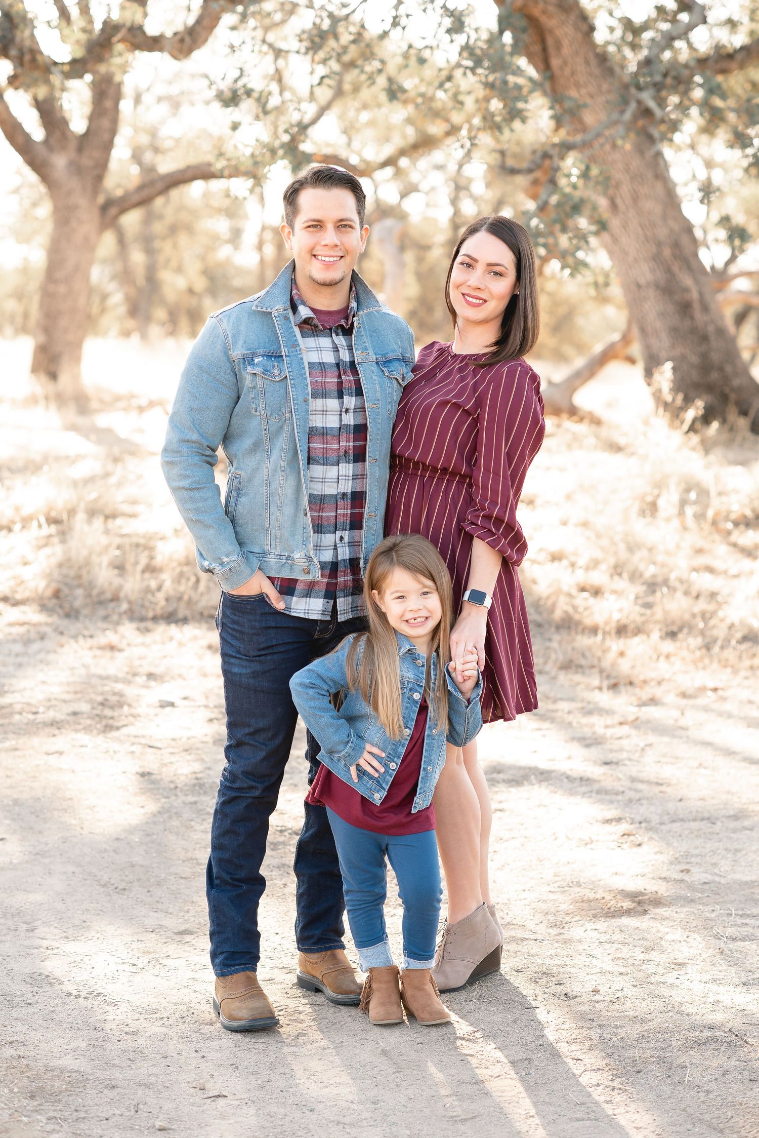 Family of 3 taken among the oak trees at Norma Hamlin Park