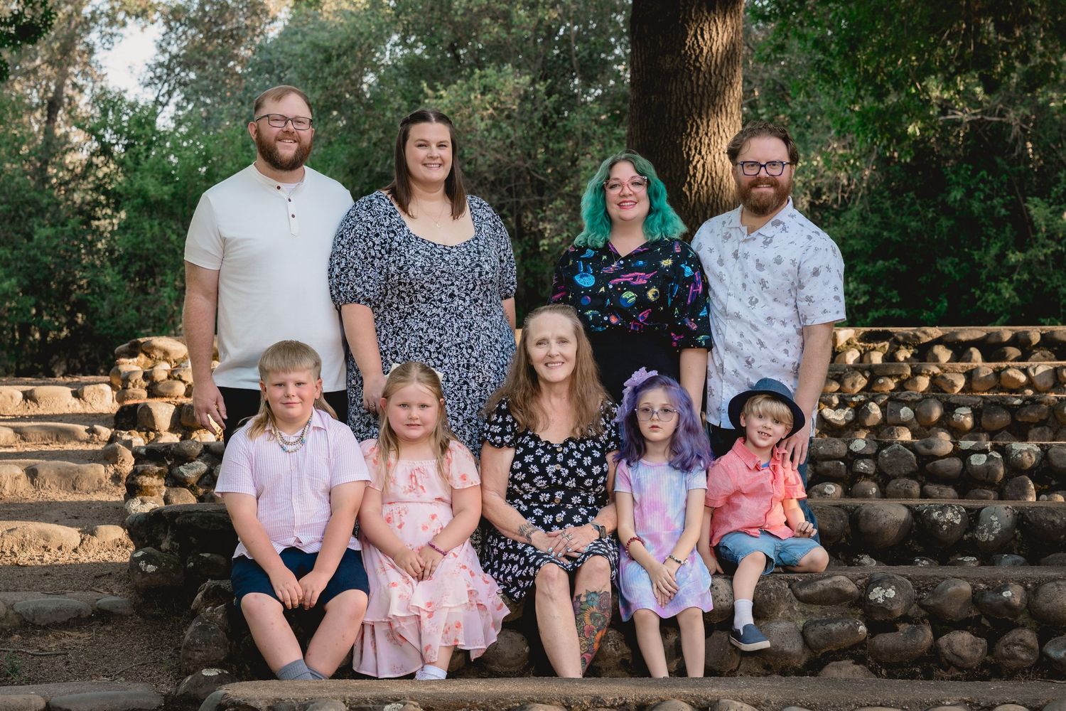 Family portrait taken on stone steps at Orangevale Community park
