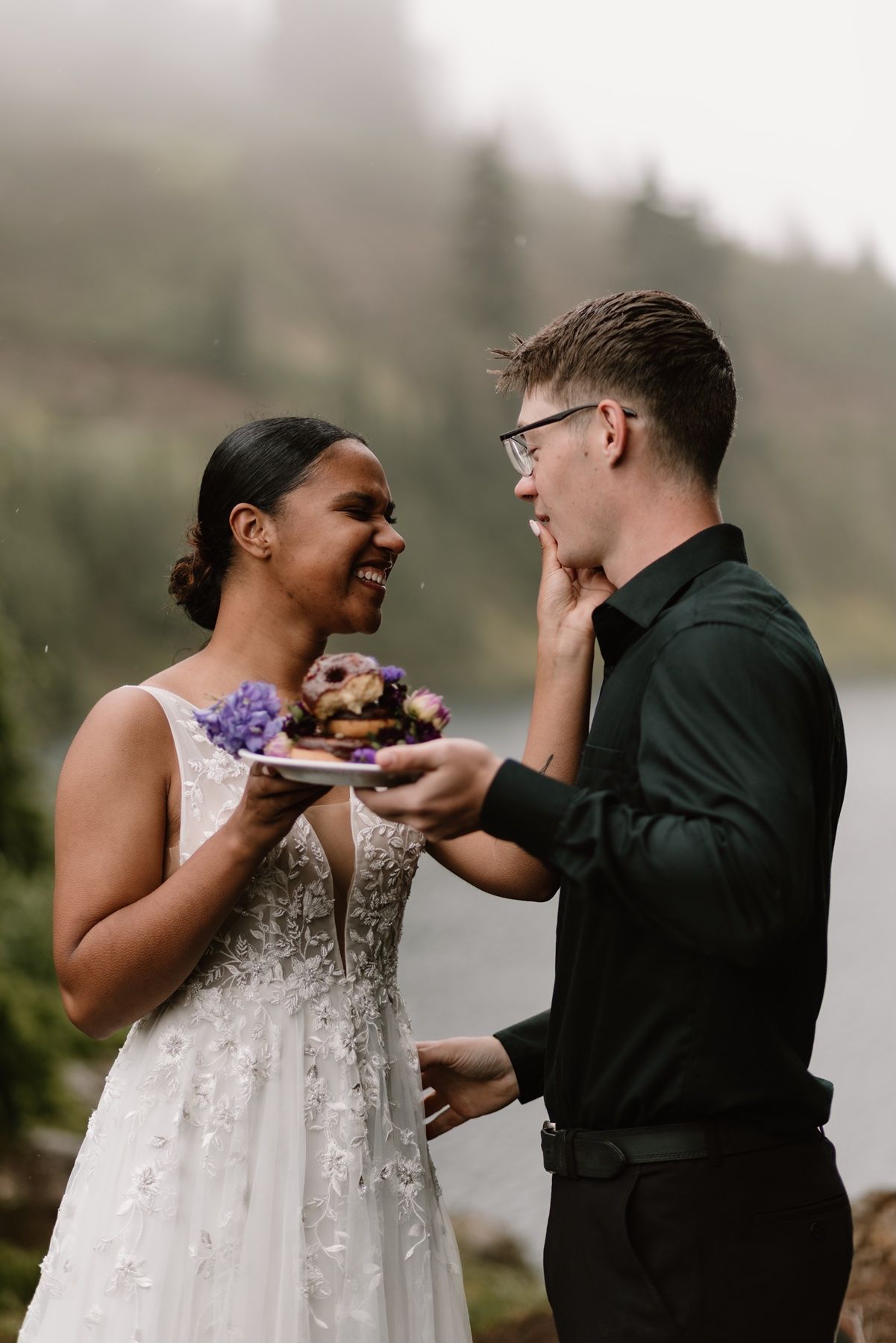 Couple shares donuts as their wedding cake during an elopement in the Pacific Northwest.