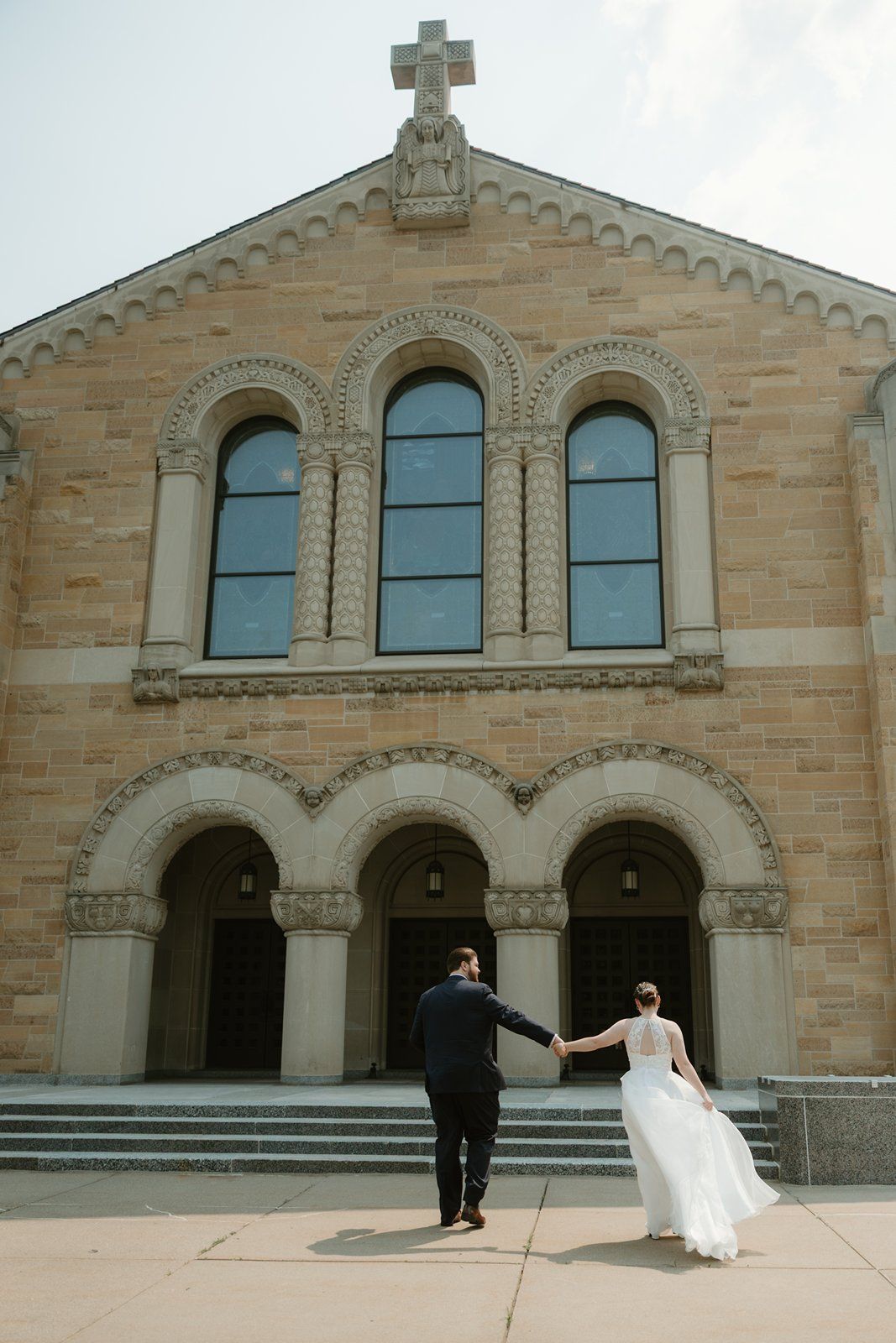 A sequence of wedding photos showing a couple dancing and posing in front of a grand stone church entrance with arches.