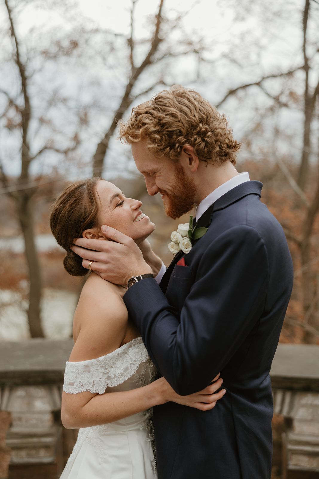 A tender moment between newlyweds as they embrace during their fall wedding photoshoot.