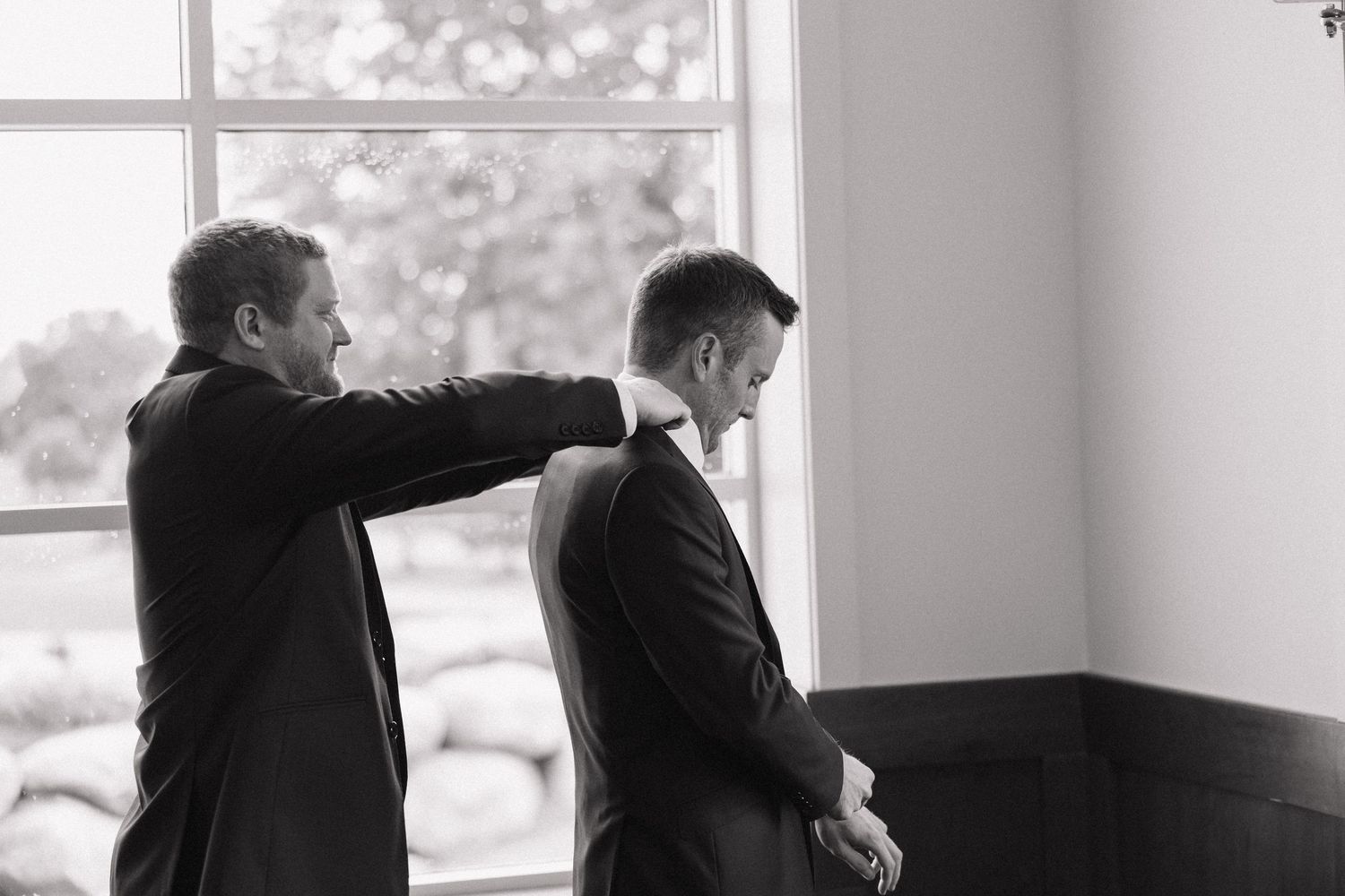 A black and white photo series showing a couple dancing together in an intimate embrace.