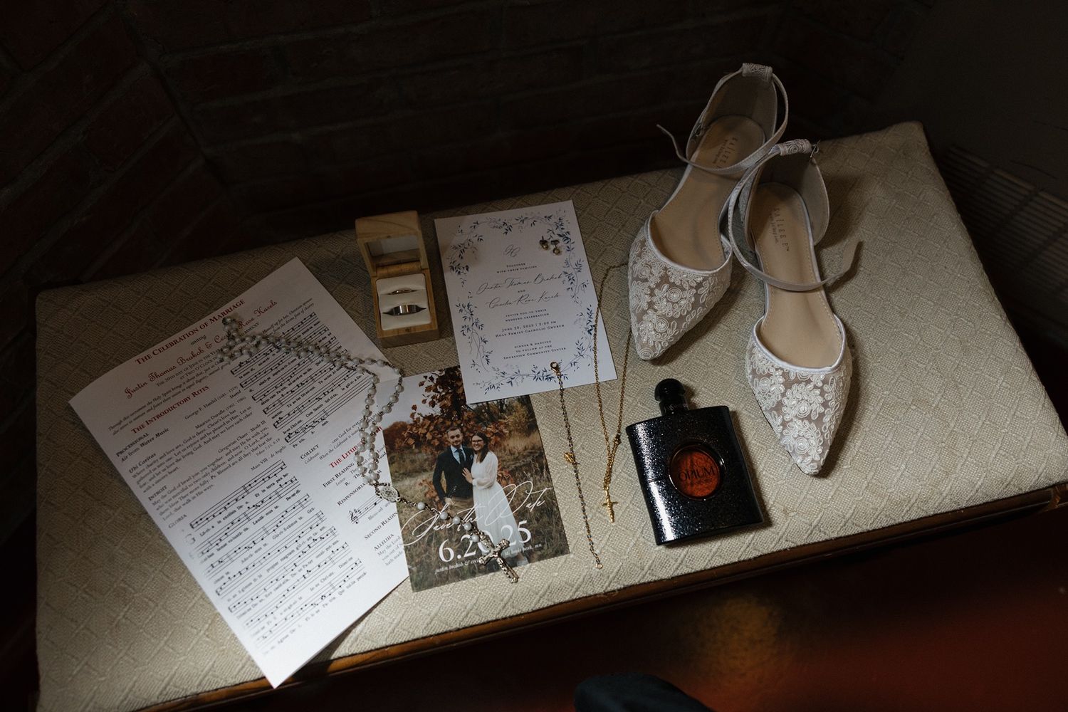 Catholic wedding photography details including a rosary and music sheet