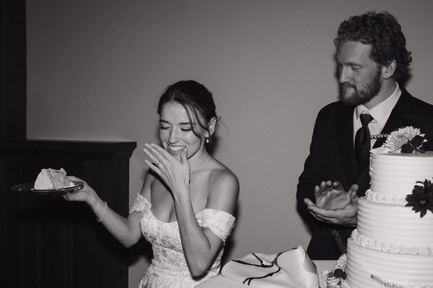 wedding photographer in Minneapolis capturing bride with her cake after the cake cutting