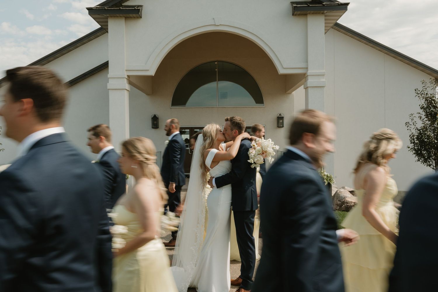 Pale yellow bridesmaid dressed in Lemon Twist from Birdy Grey