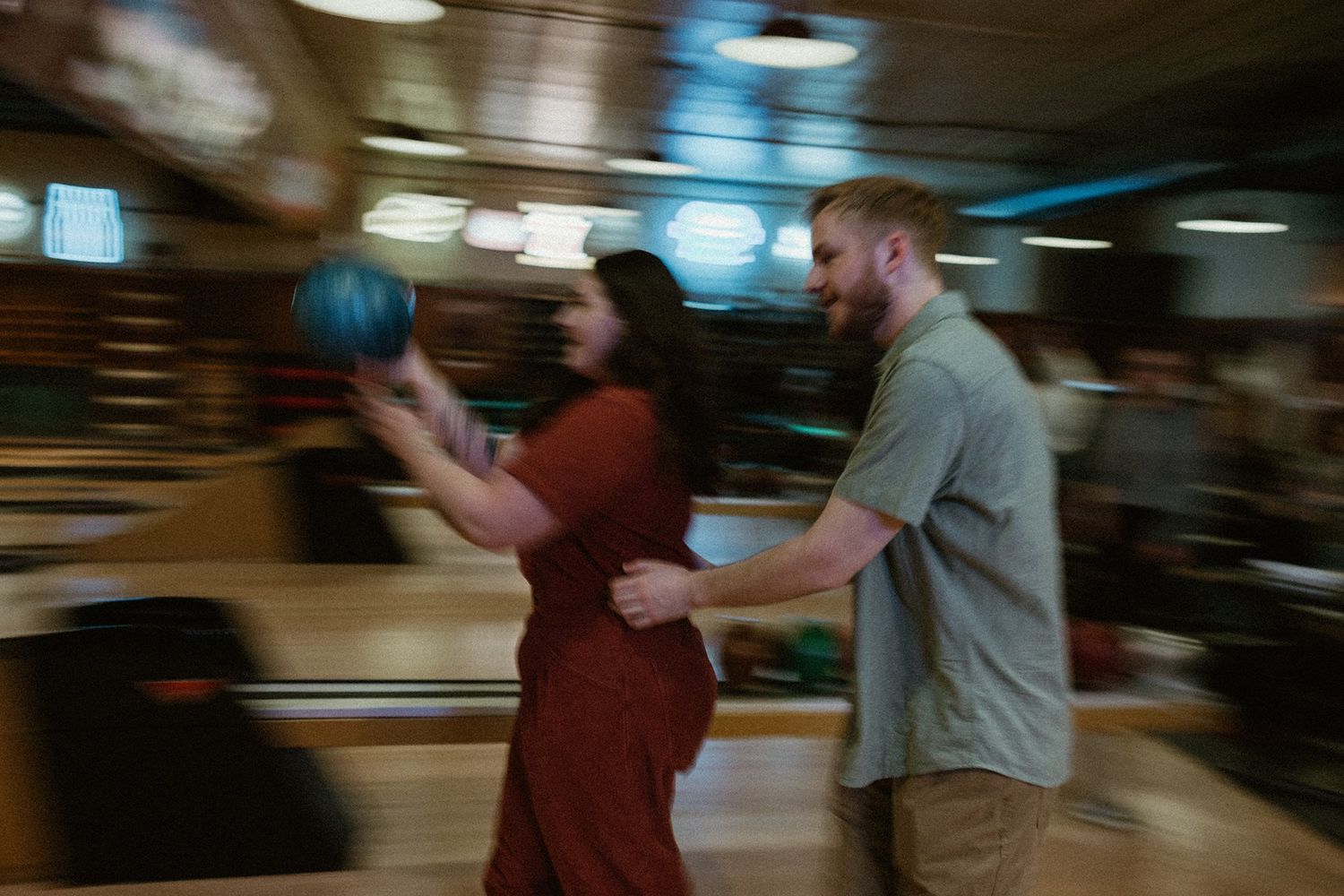 A series of blurred motion shots showing a fight sequence between two people in an indoor setting.