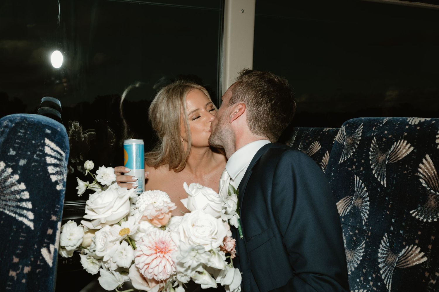 A romantic wedding kiss sequence captured in multiple frames under moonlit night sky with white floral bouquet.