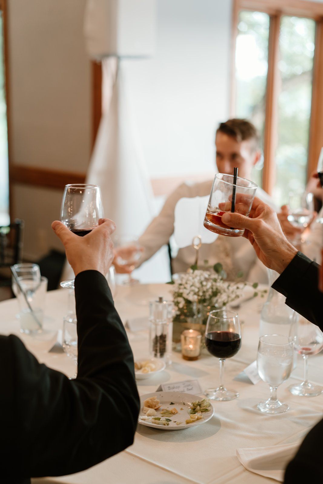 A series of elegant wine glasses and table settings at a formal dinner party shown across multiple frames.