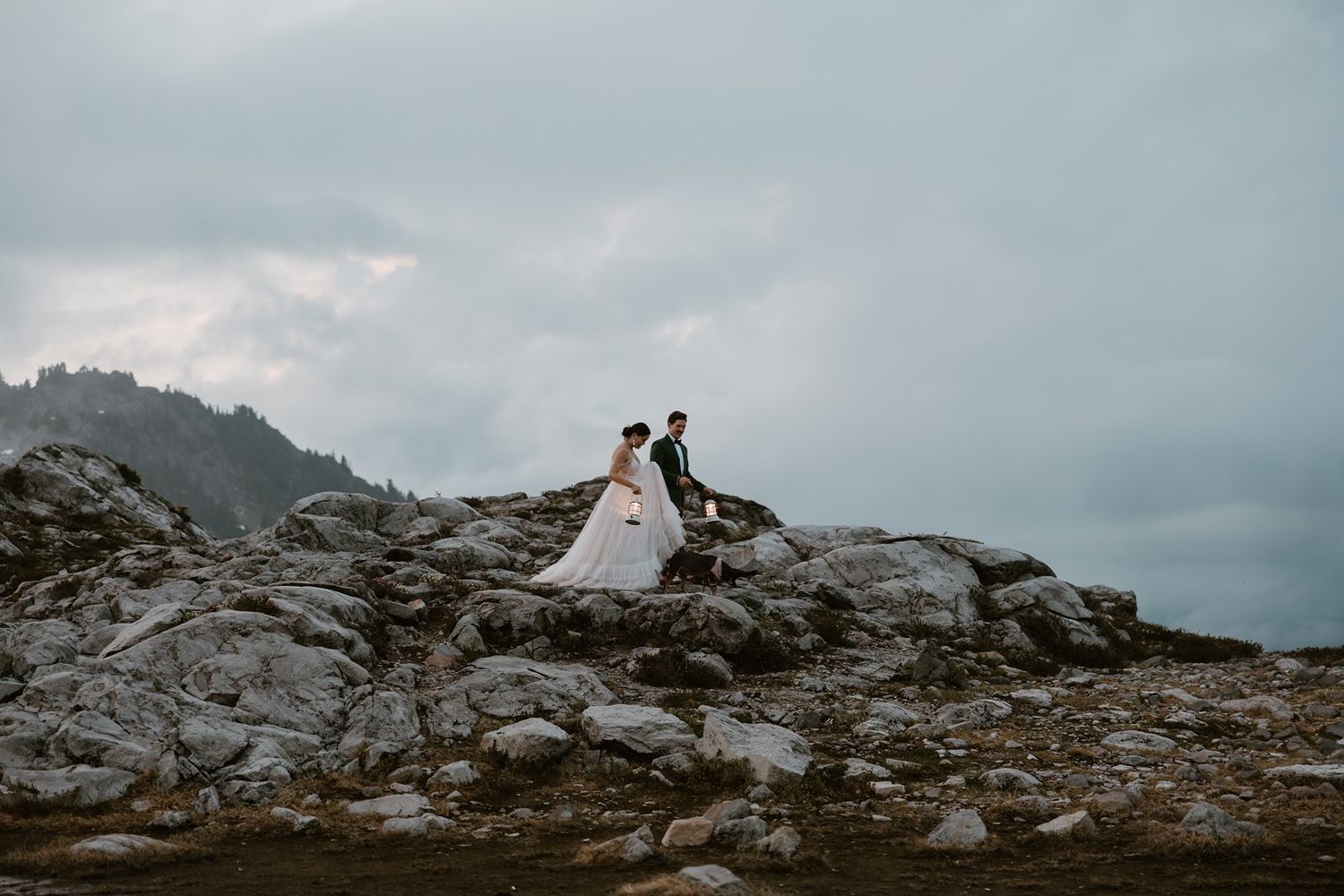 Adventure elopement photographer capturing a couple in a scenic Pacific Northwest landscape