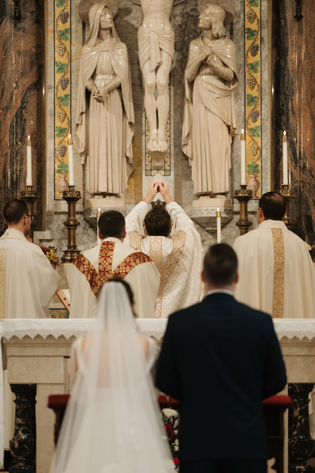 Catholic wedding photographer capturing a church ceremony during Mass