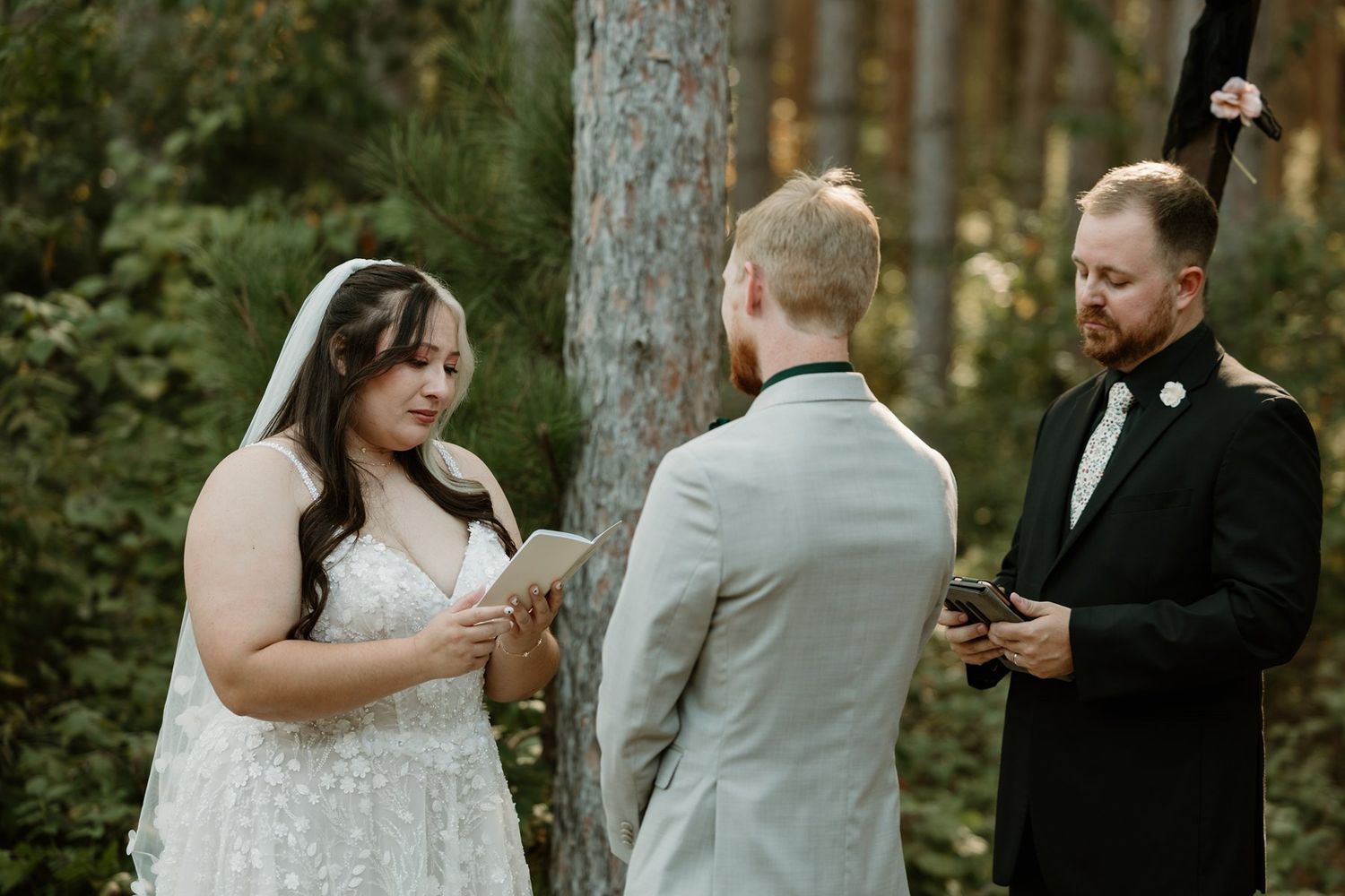 Emotional bride and groom personal vow moment at Pinewood in Cambridge, MN on a sunny fall day.