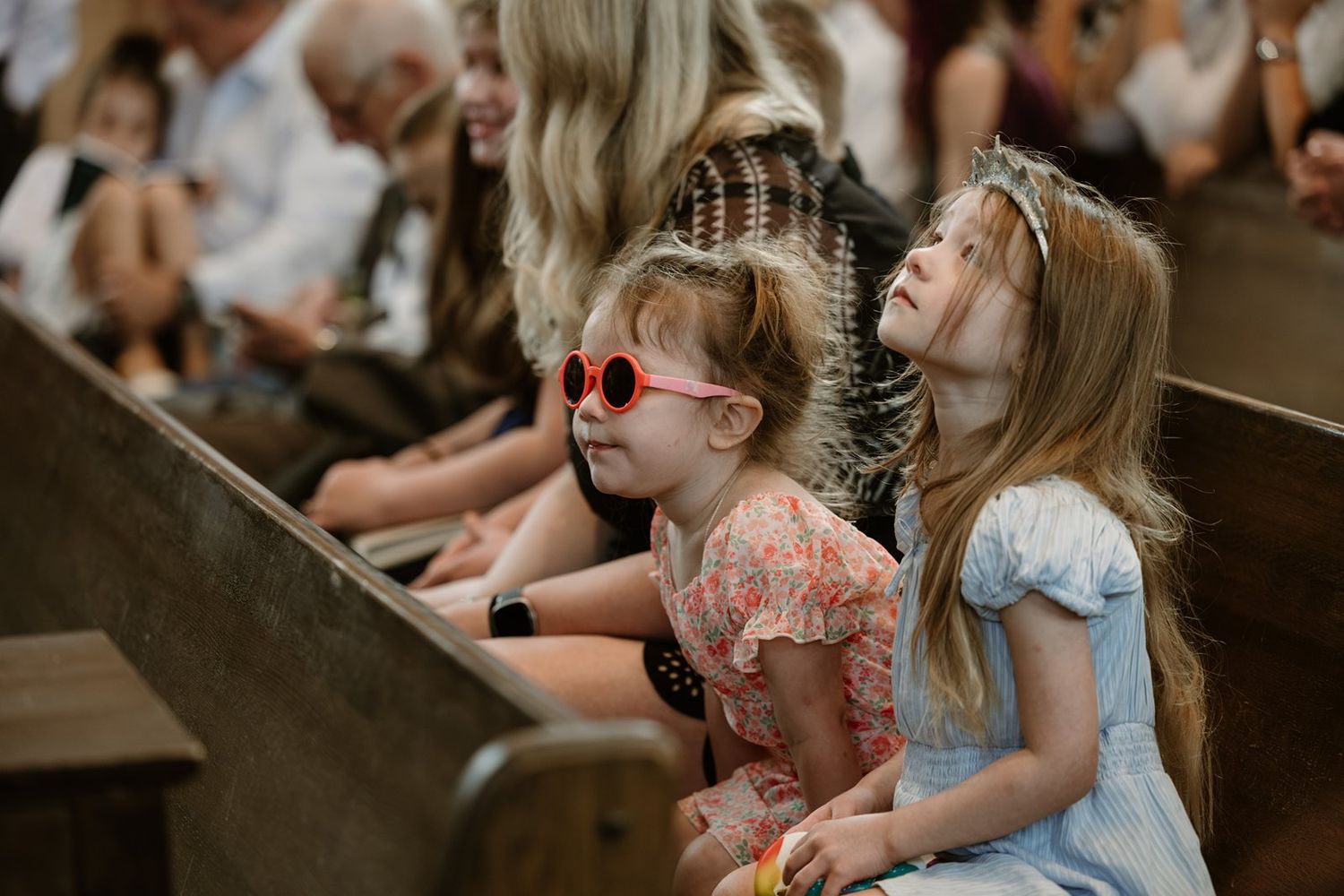 Children watching attentively during a church service or performance.