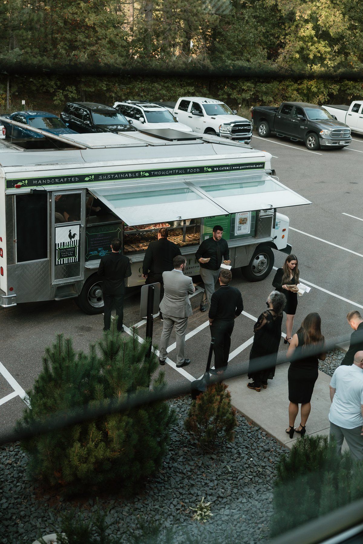 Guests line up at Gastrotruck food truck to get tacos at Pinewood.