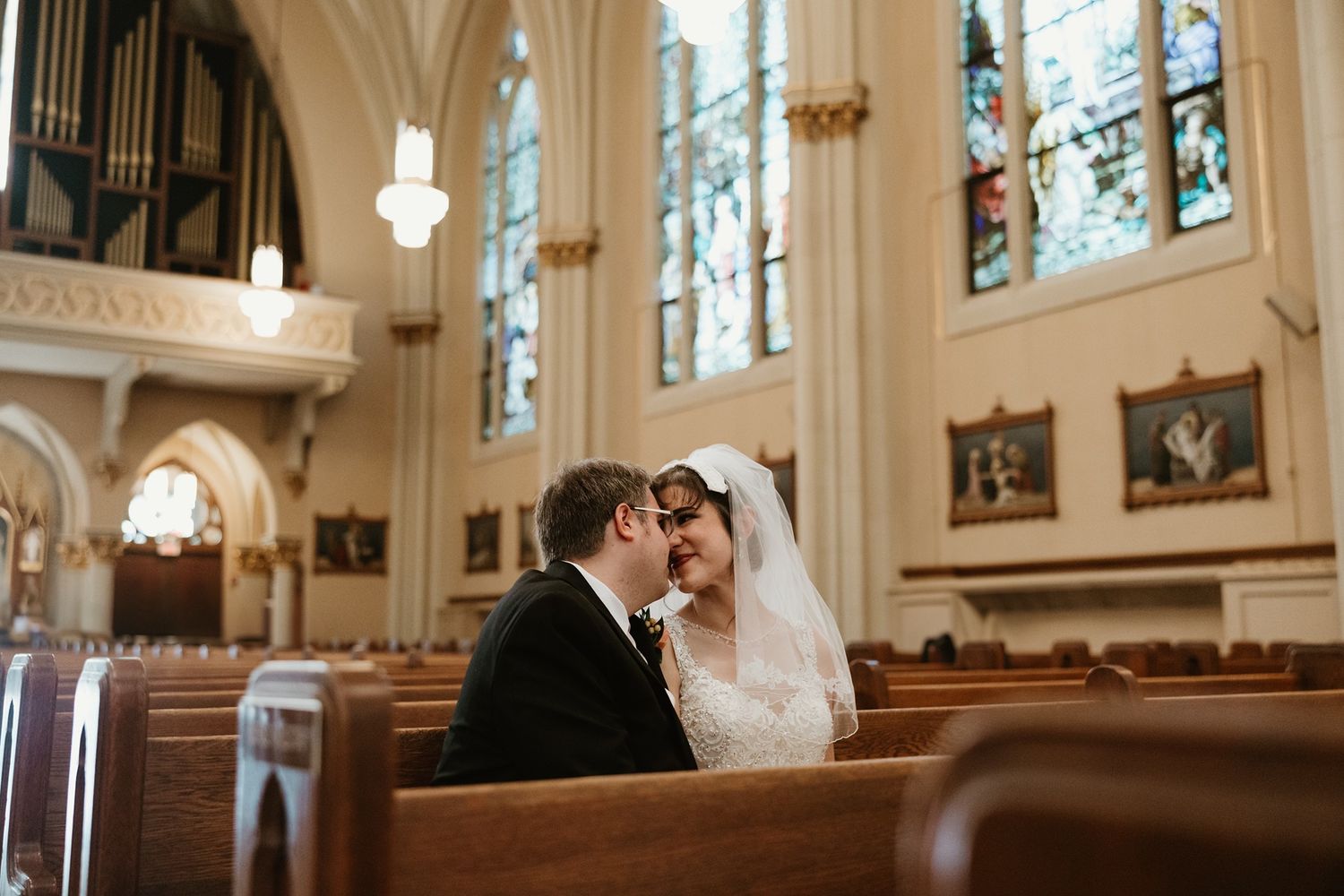Bride and groom catholic wedding portraits in a stunning cathedral