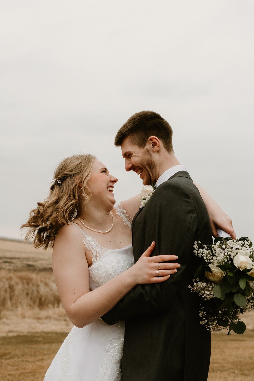 A couple shares intimate moments in a series of candid wedding photos against a rustic outdoor landscape.