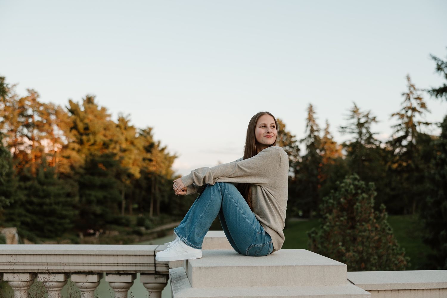 Minneapolis senior photographer guiding relaxed portrait poses
