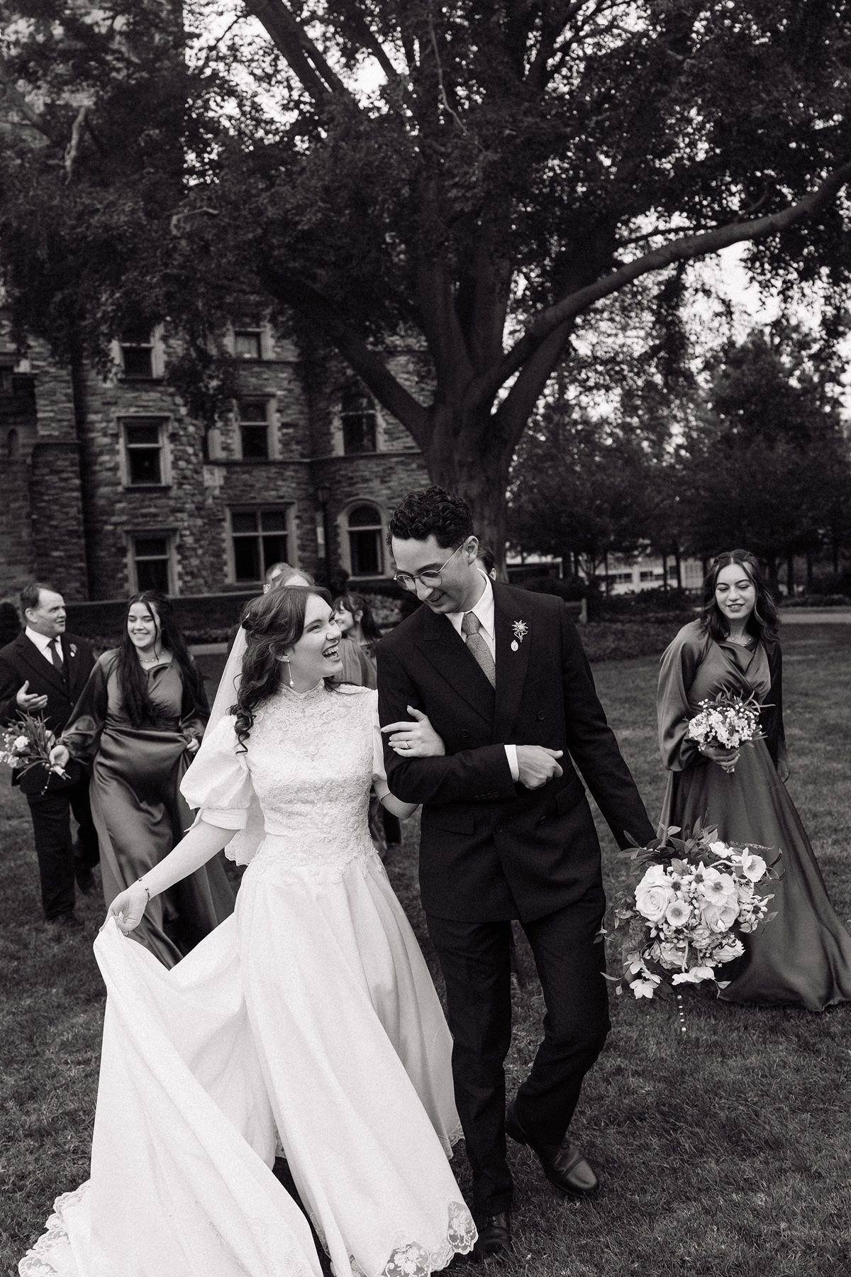 wedding photographer in Minneapolis capturing photos of a wedding party in black and white
